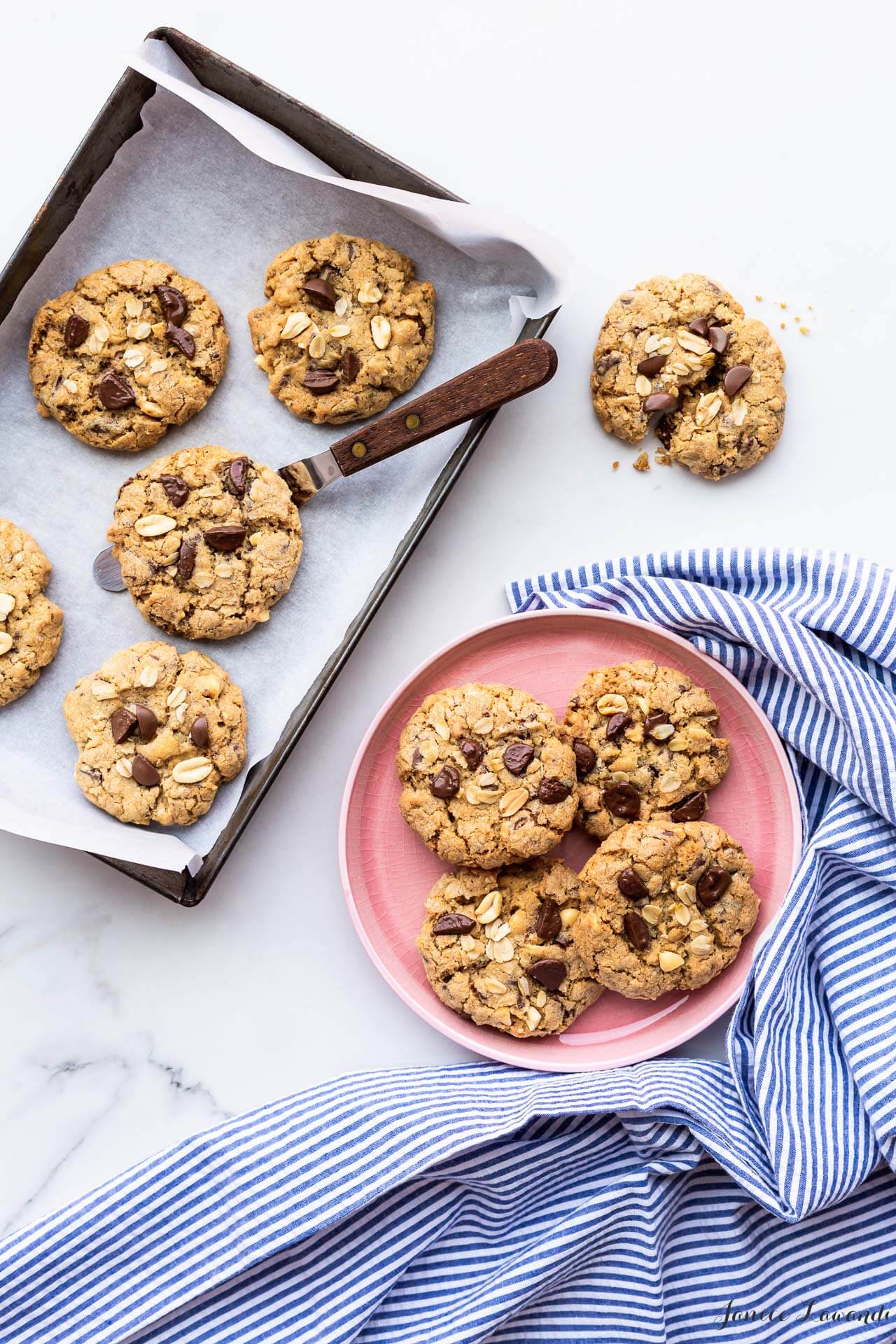 Thick and chewy oatmeal chocolate chunk cookies with peanuts