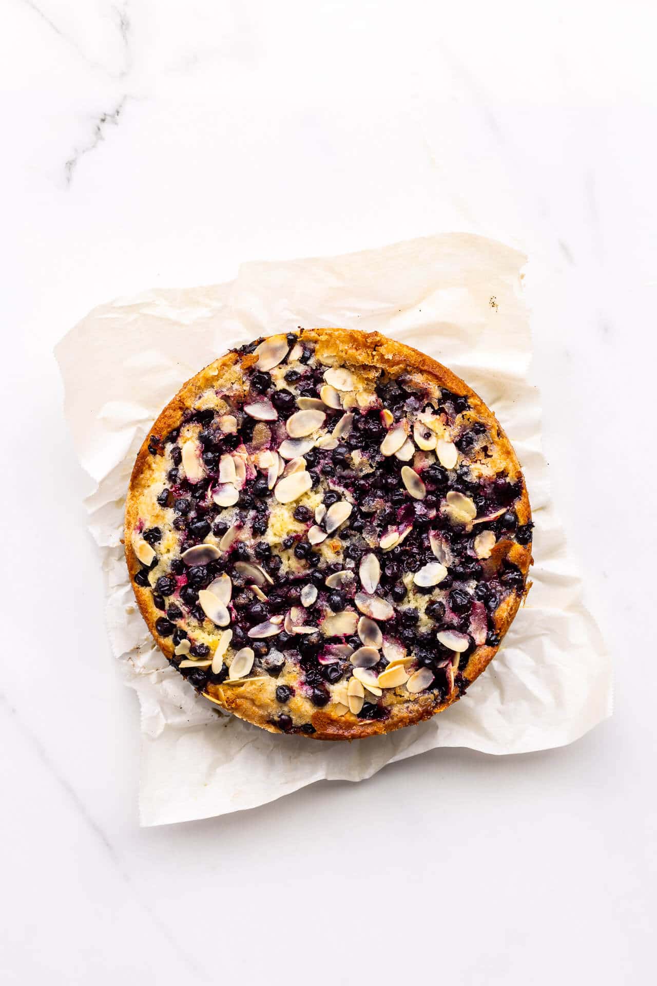 Black currant cake on parchment paper