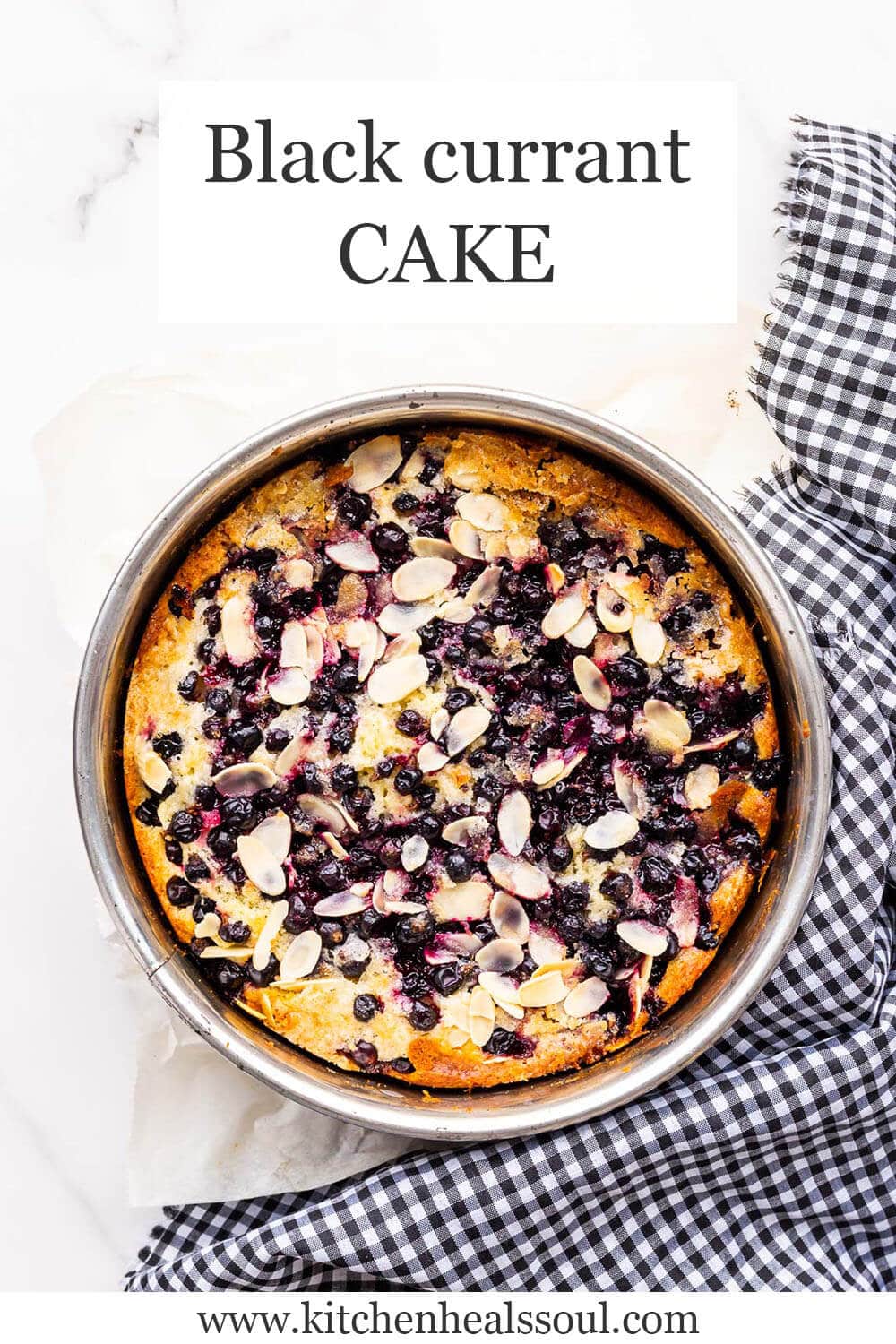 Black currant cake in springform with black and white checkered linen