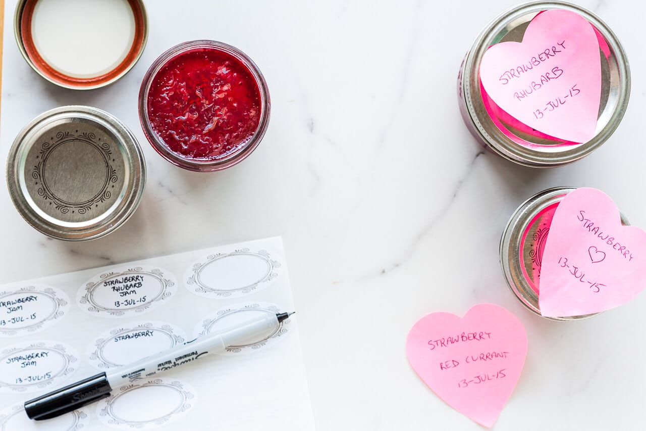 Labelling jars of jam with stickers to identify them (or heart shaped post-it notes)