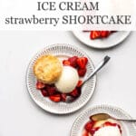Ice cream strawberry shortcakes with biscuits on dessert plates