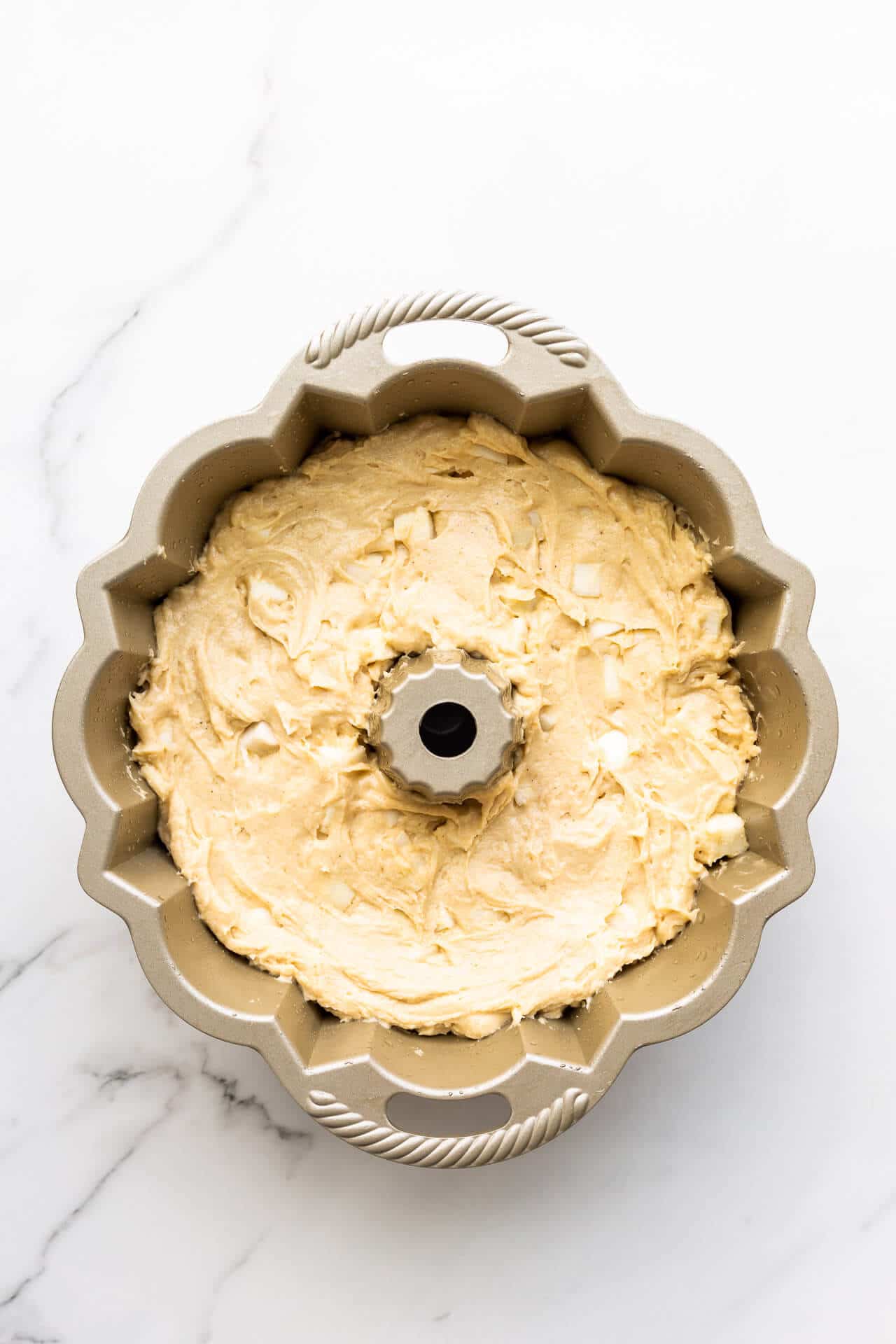 Cake batter in bundt cake pan before baking