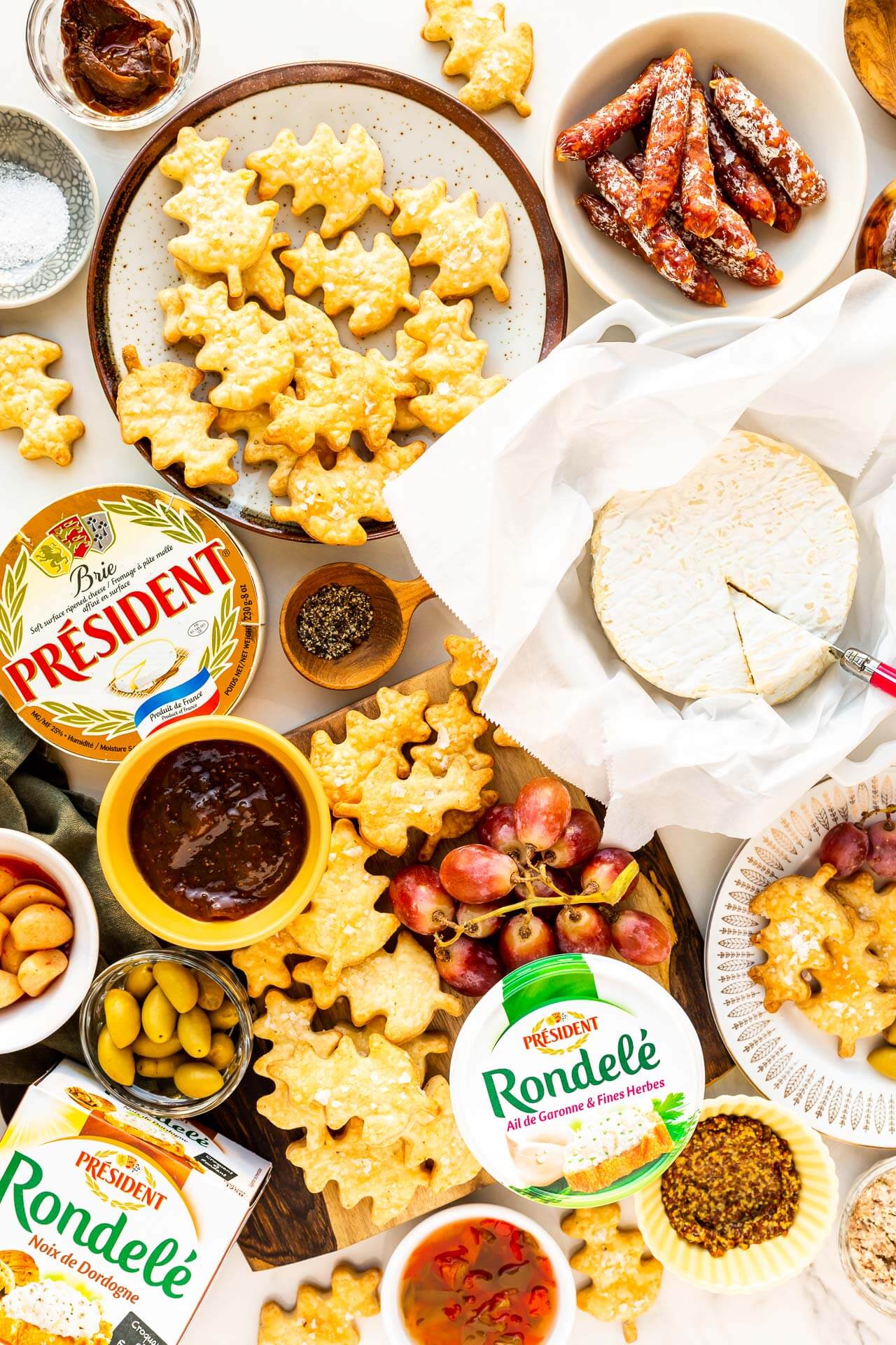 Holiday cheese board featuring Président cheeses and homemade savoury shortbread biscuits.