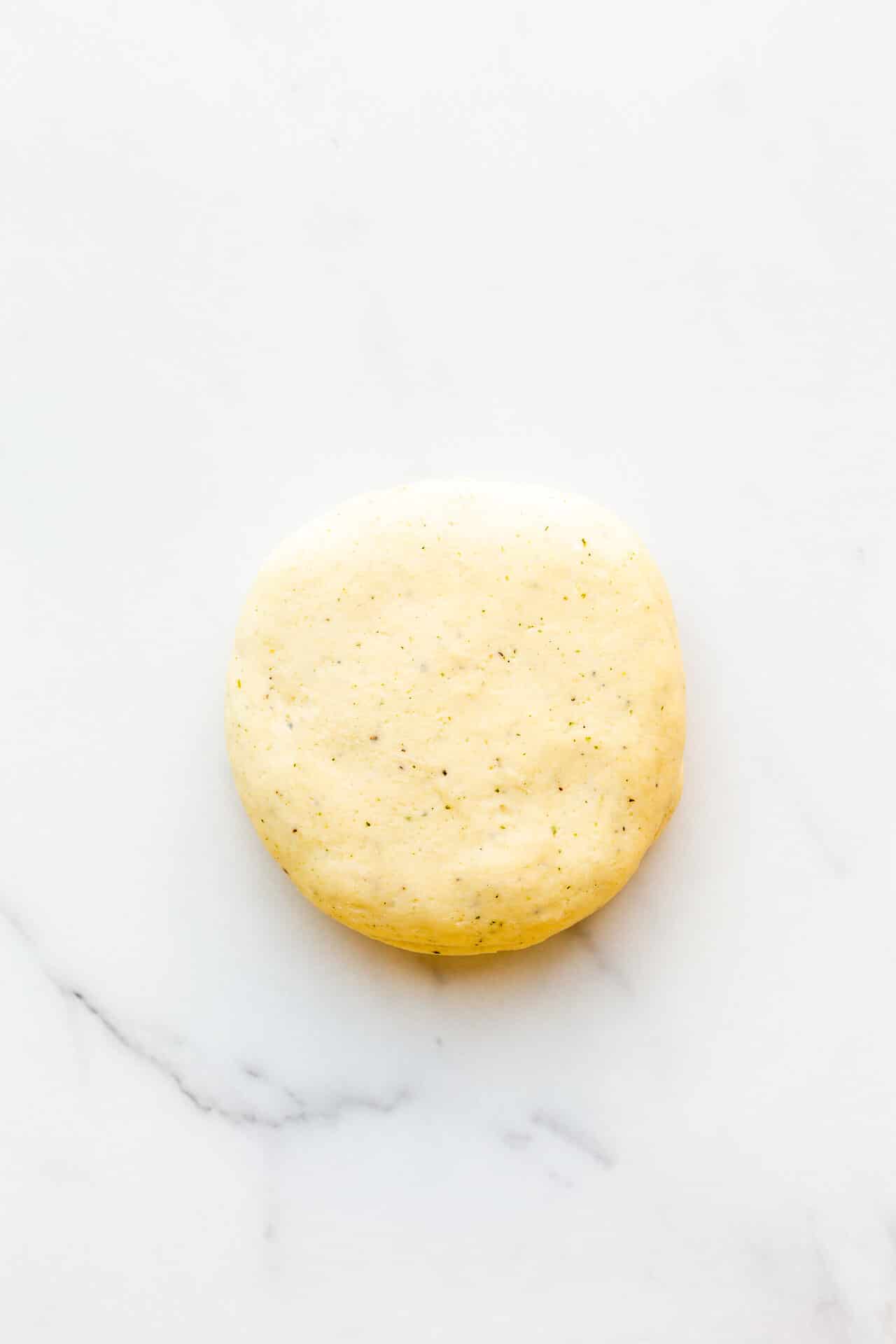 Shortbread dough for savoury crackers speckled with black pepper. Ready to be rolled out and cut into shapes to bake.