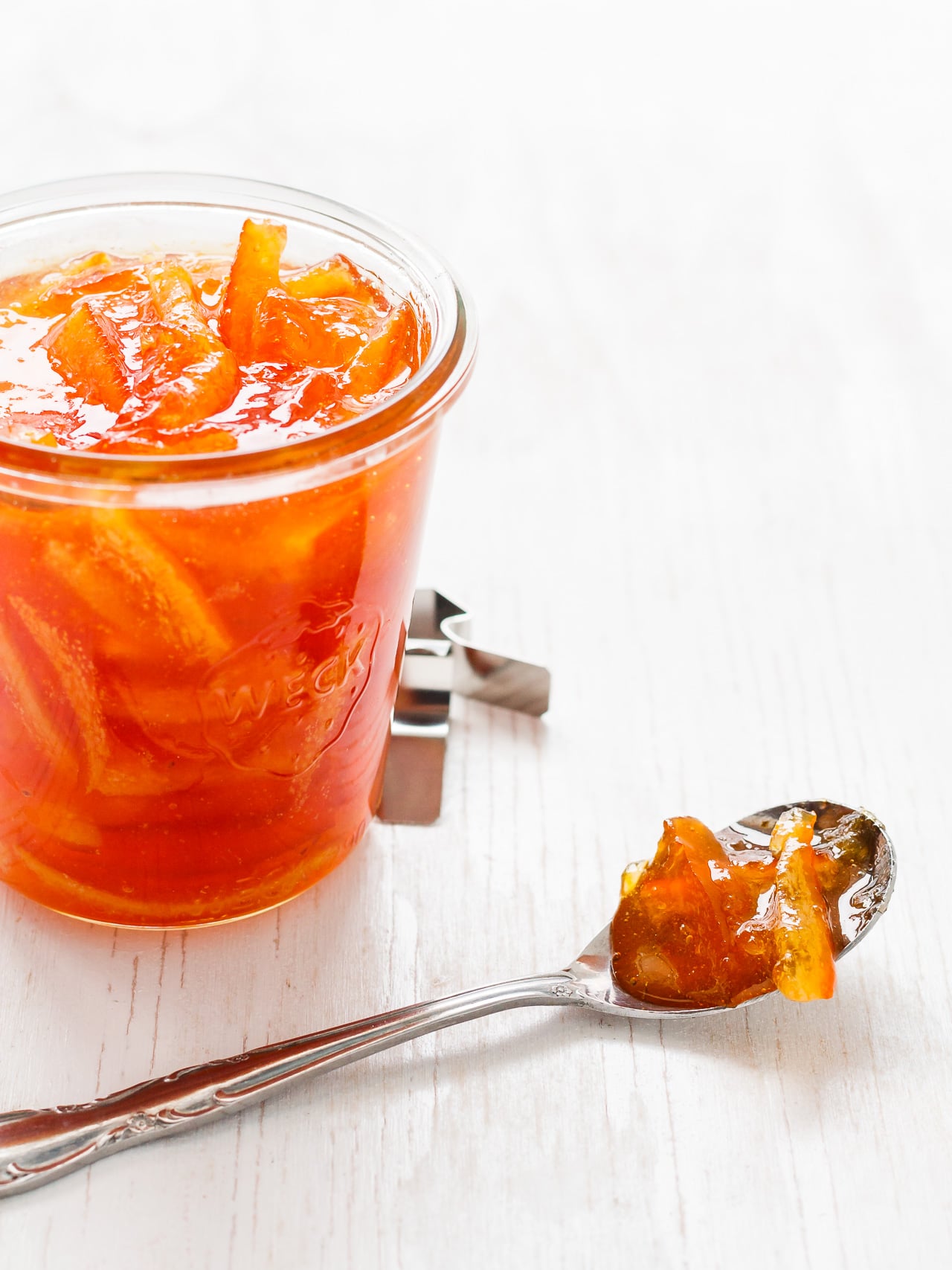 Homemade marmalade in a weck jar, served by the spoonful.