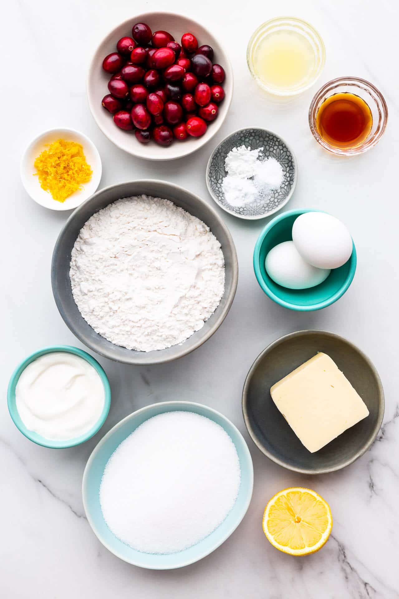 Ingredients to make cranberry lemon muffins.