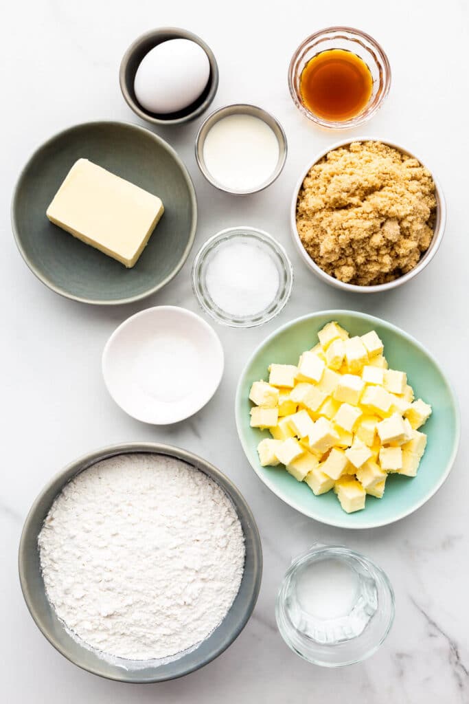 Ingredients to make butter tarts from scratch measured out, including ingredients to make both the crust and the filling.