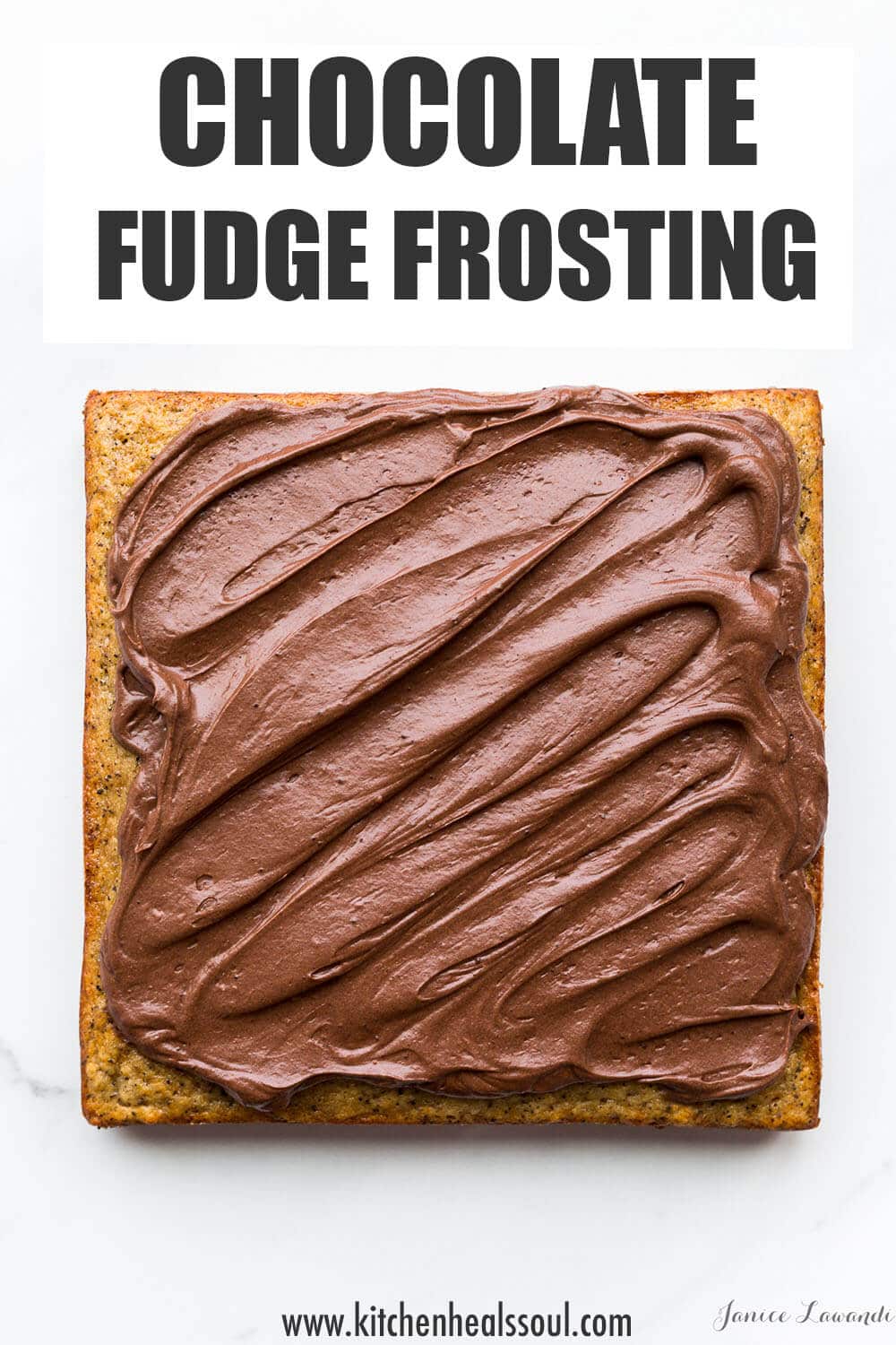 Chocolate fudge frosting on a square banana cake.