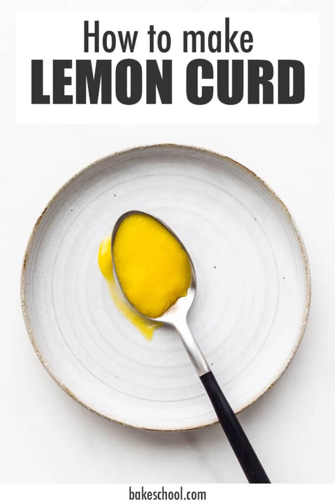 Spoonful of lemon curd on a grey plate.