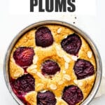 Cake with plums and sliced almonds, baked in a springform pan.