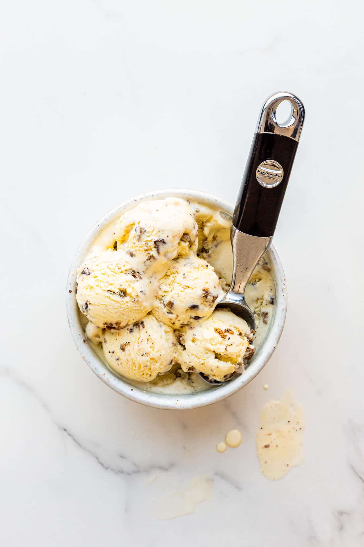 Chocolate chip cookie ice cream scooped with an ice cream scoop and ready to serve.