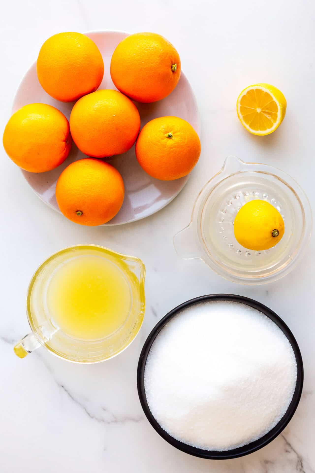 Ingredients to make homemade orange marmalade measured out.