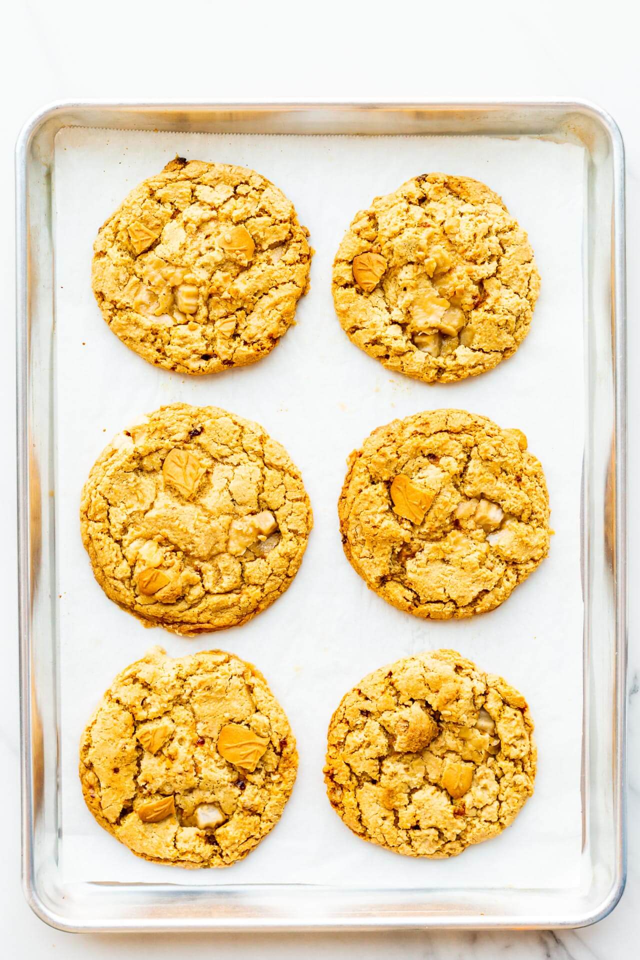 A sheet pan of freshly baked maple coookies.