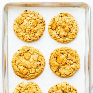 Maple cookies cooling on a sheet pan.