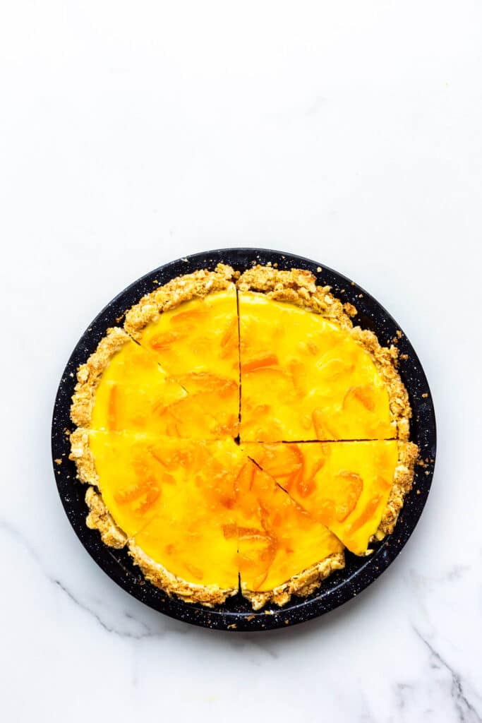 Orange pie with saltine crust sliced and ready to serve.