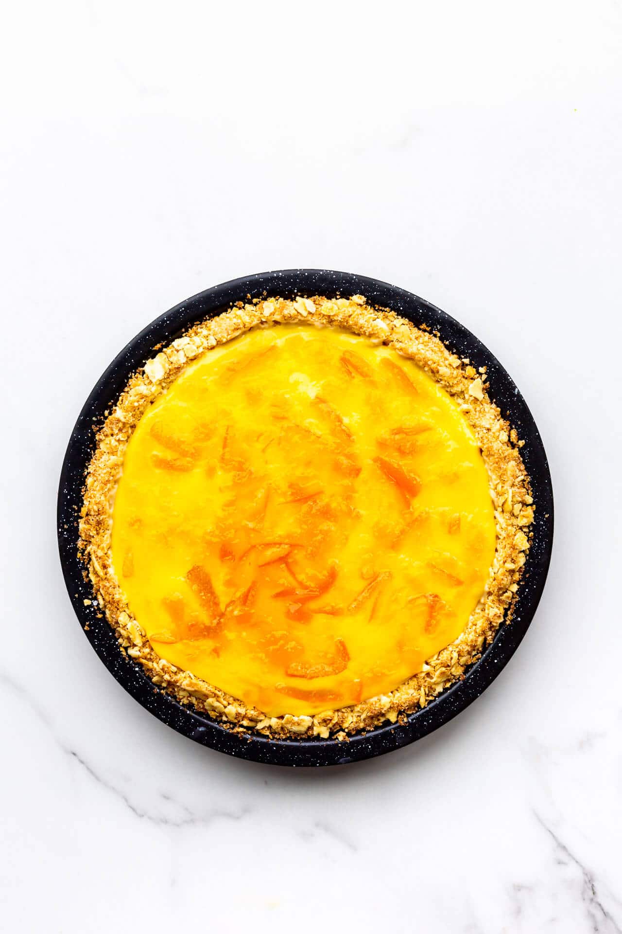 Orange pie glazed with orange marmalade.