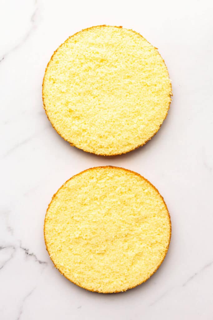 Sponge cake split into two equal layers.