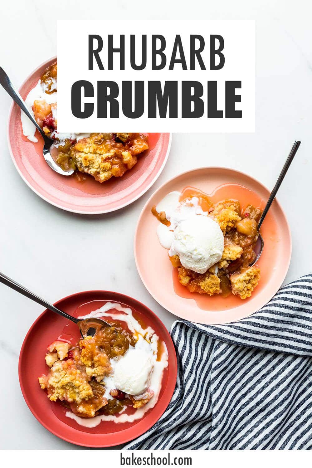 Warm rhubarb crisp in pink bowls served with vanilla ice cream.