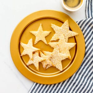 A gold plate of sugar cookie stars.