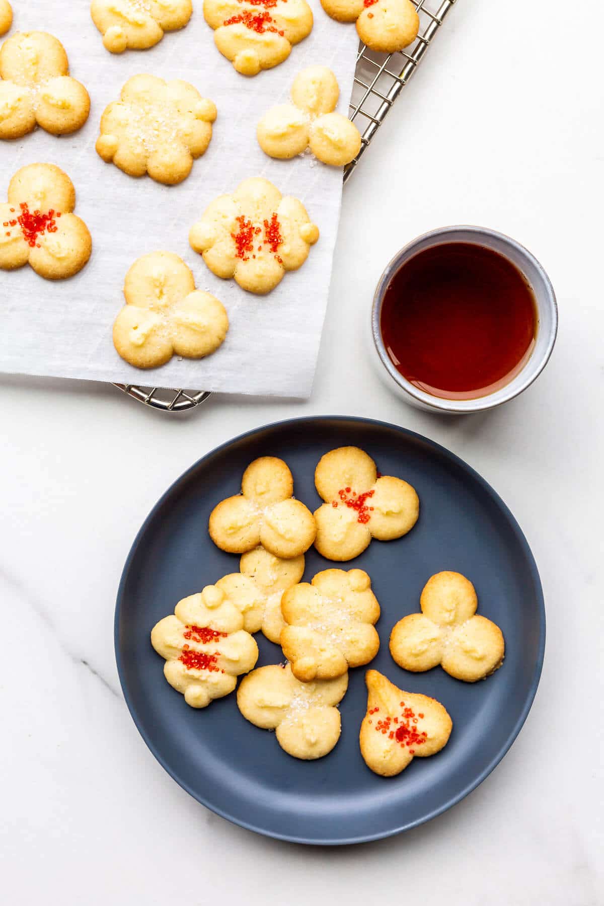 Serving spritz cookies with tea.