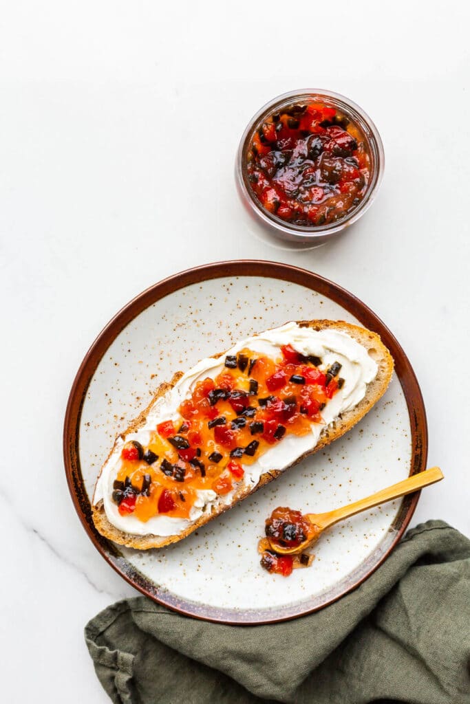 Pepper jam and cream cheese on bread.