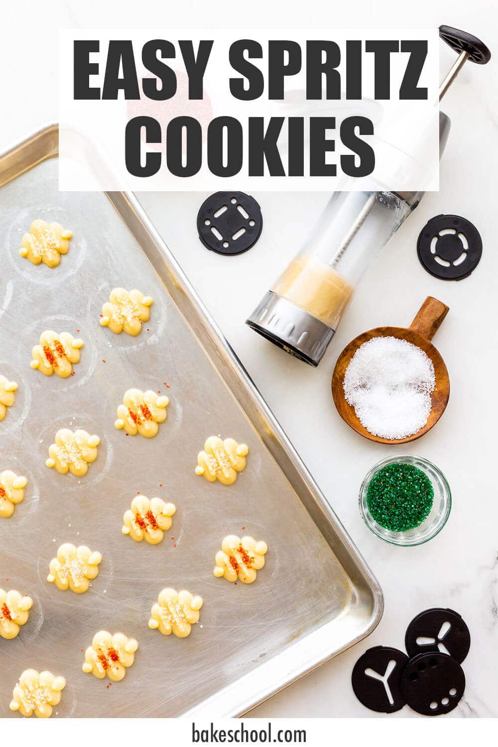 Using a cookie press to press out spritz cookies on an ungreased cookie sheet. The cookies are sprinkled with colourful sanding sugar before baking.