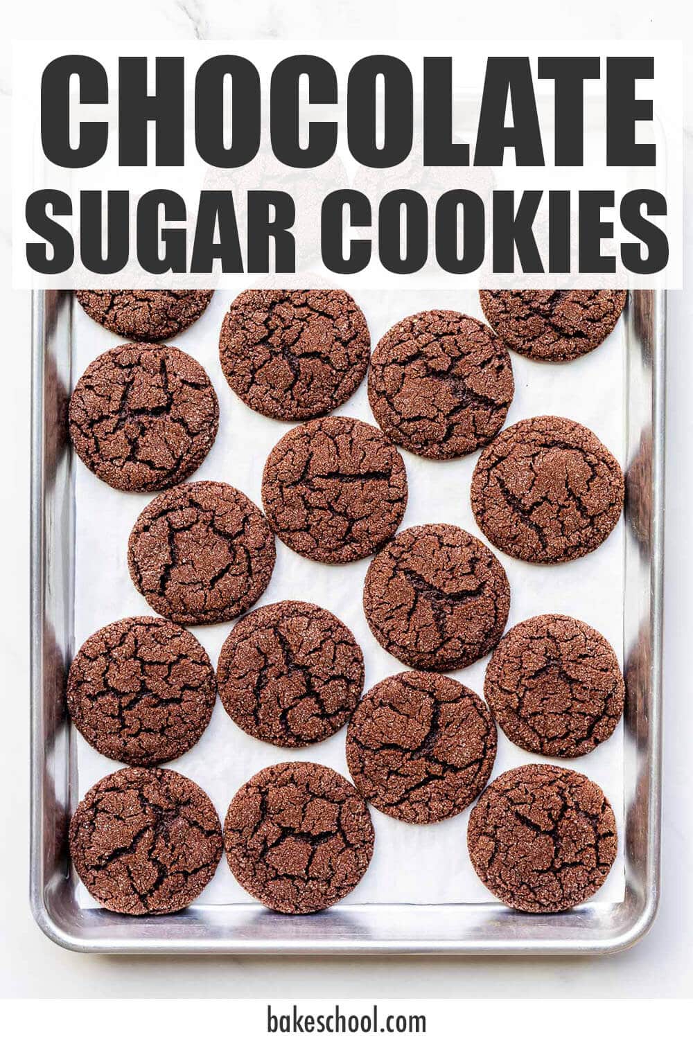 A sheet pan of freshly baked chocolate sugar cookies.