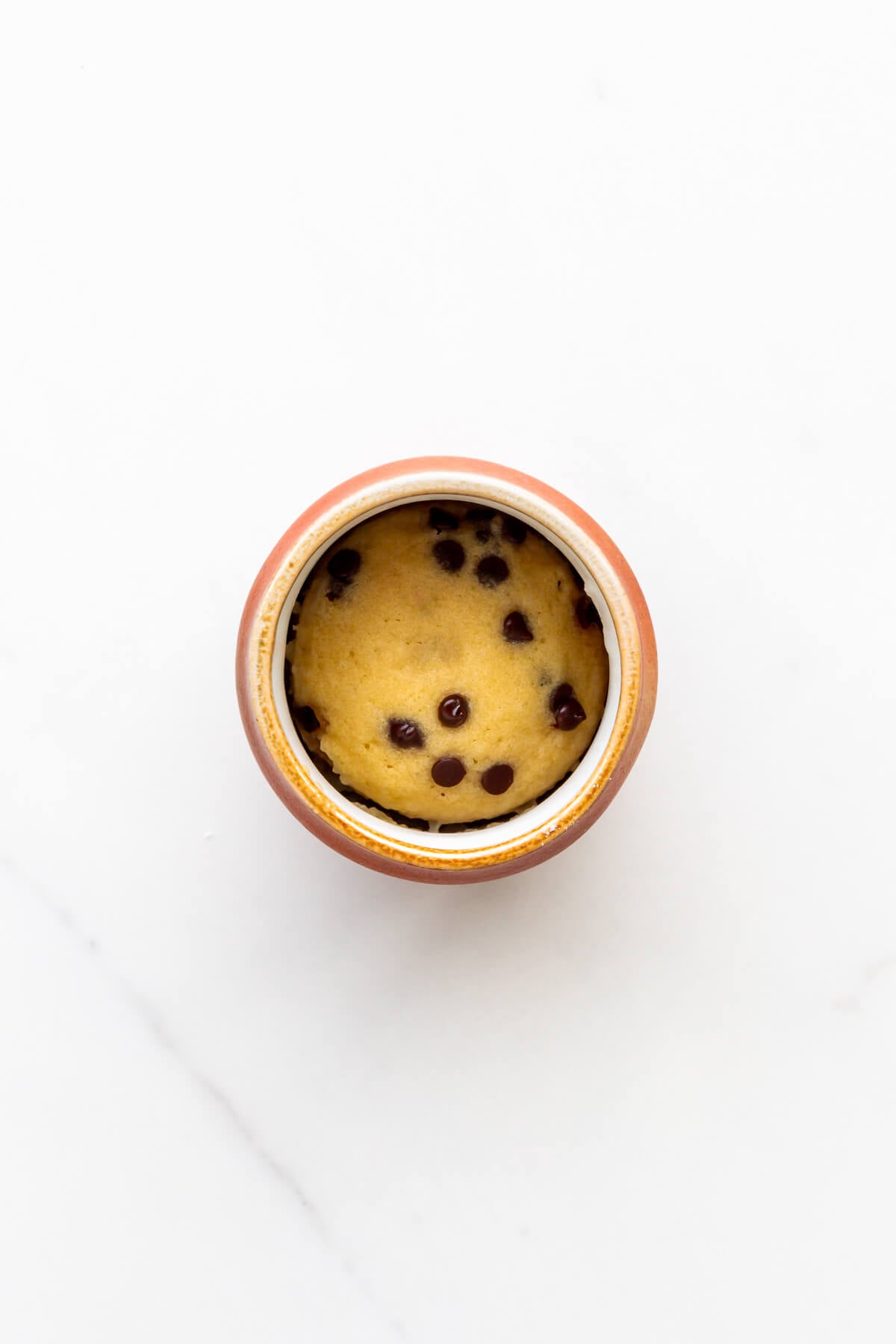 Chocolate chip mug cake cooked directly in a mug.