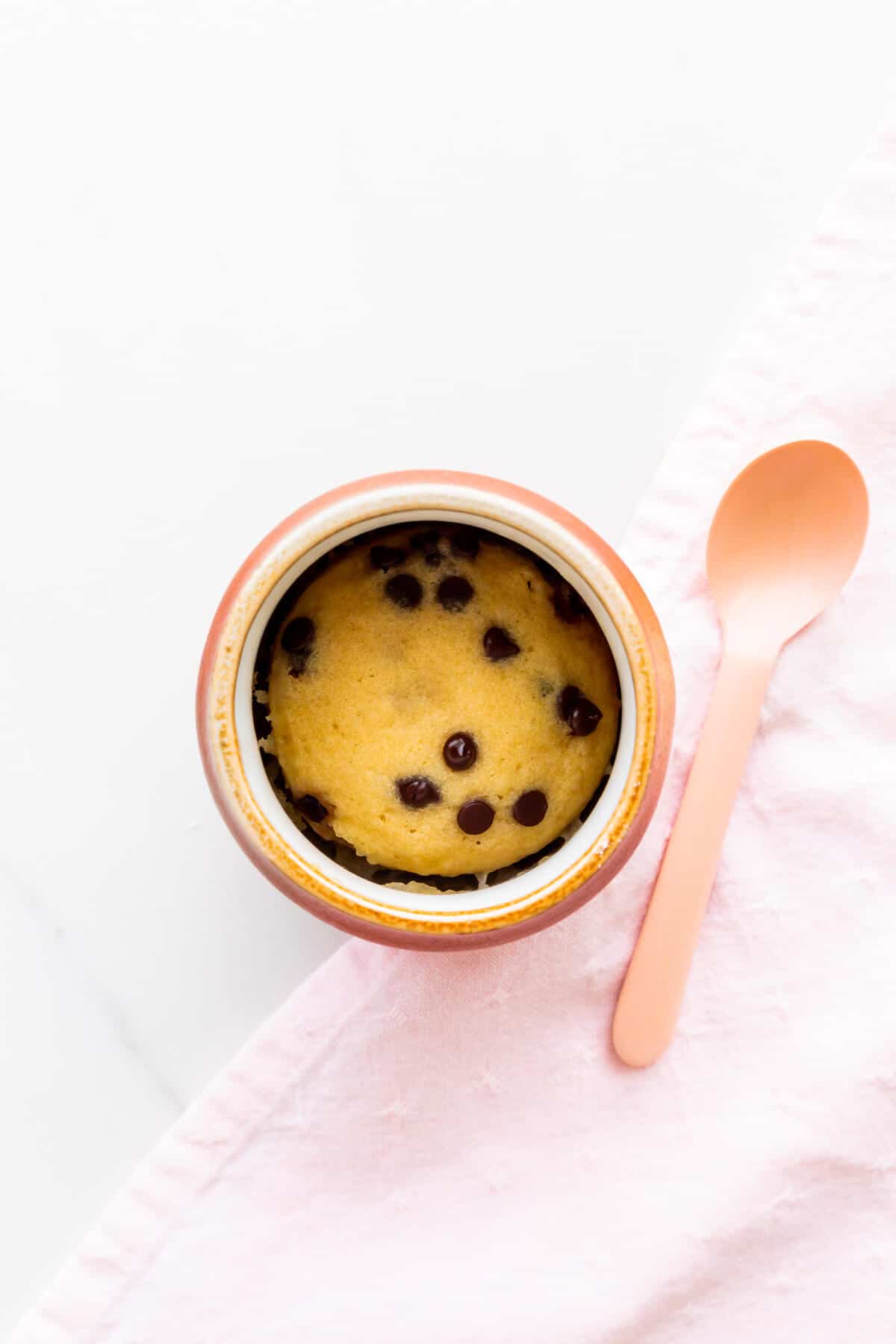 Chocolate chip mug cake cooked directly in a mug.