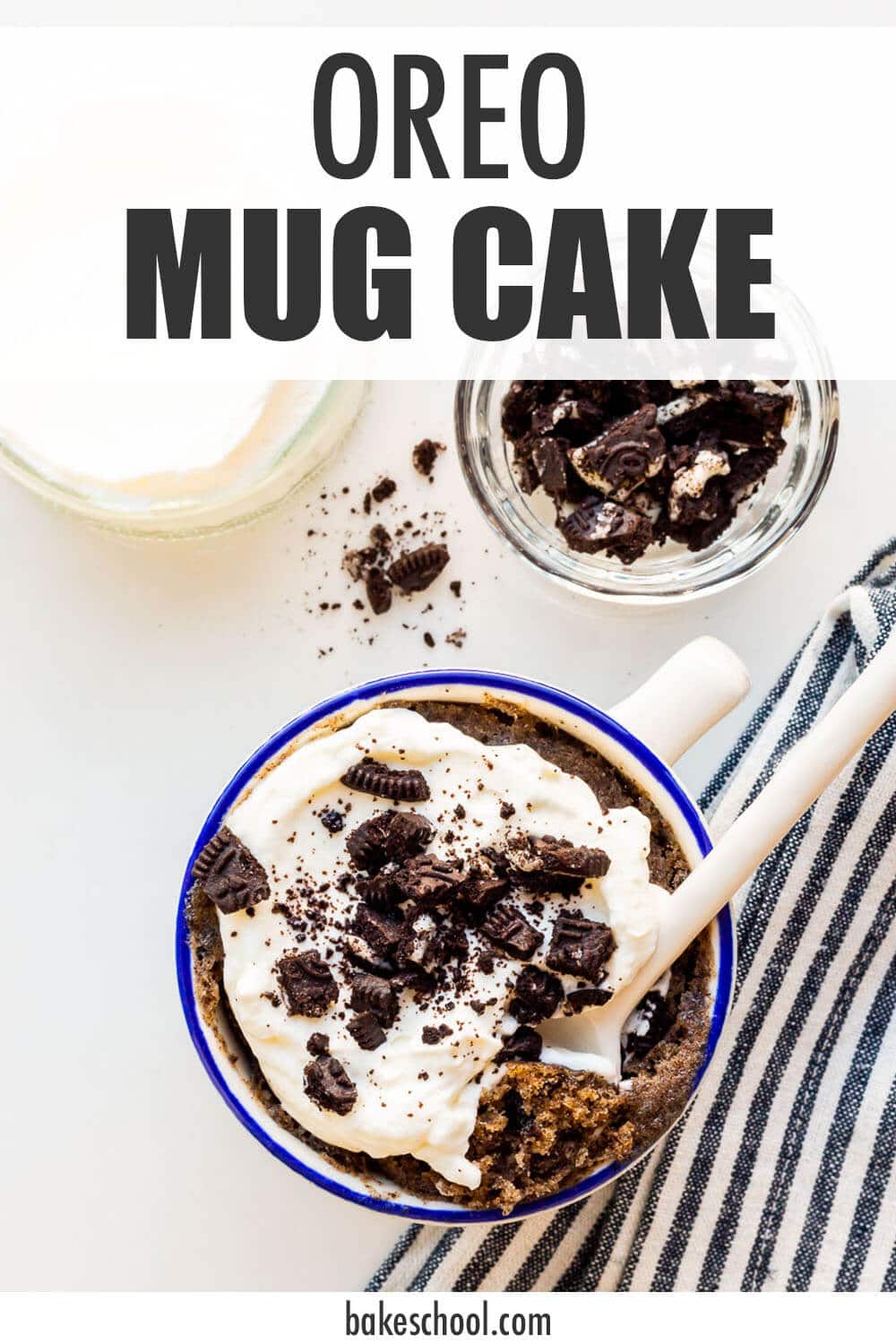 Image of Oreo mug cake topped with whipped cream and crushed Oreo cookies.
