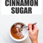 Mixing cinnamon with sugar to make cinnamon sugar.