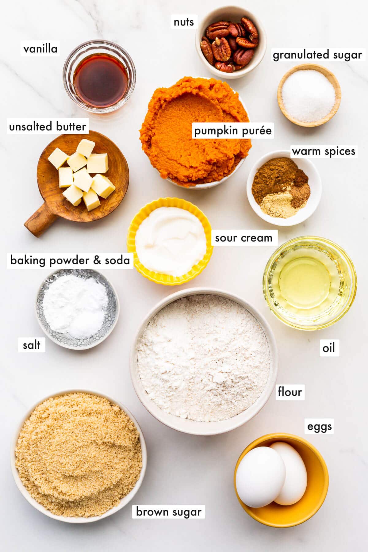 Ingredients to make pumpkin muffins from scratch, measured out and ready to be mixed.