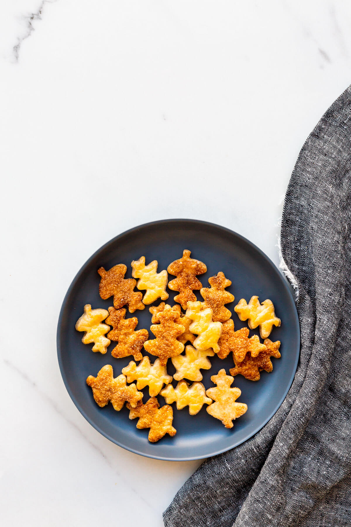 Leaf-shaped pie crust cookie cutouts for decorating a pumpkin pie.