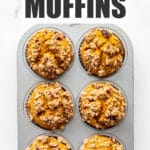 A muffin pan of pumpkin muffins, freshly baked.