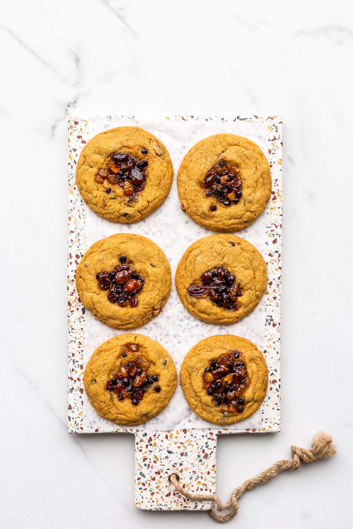 A terrazzo board with mincemeat cookies.