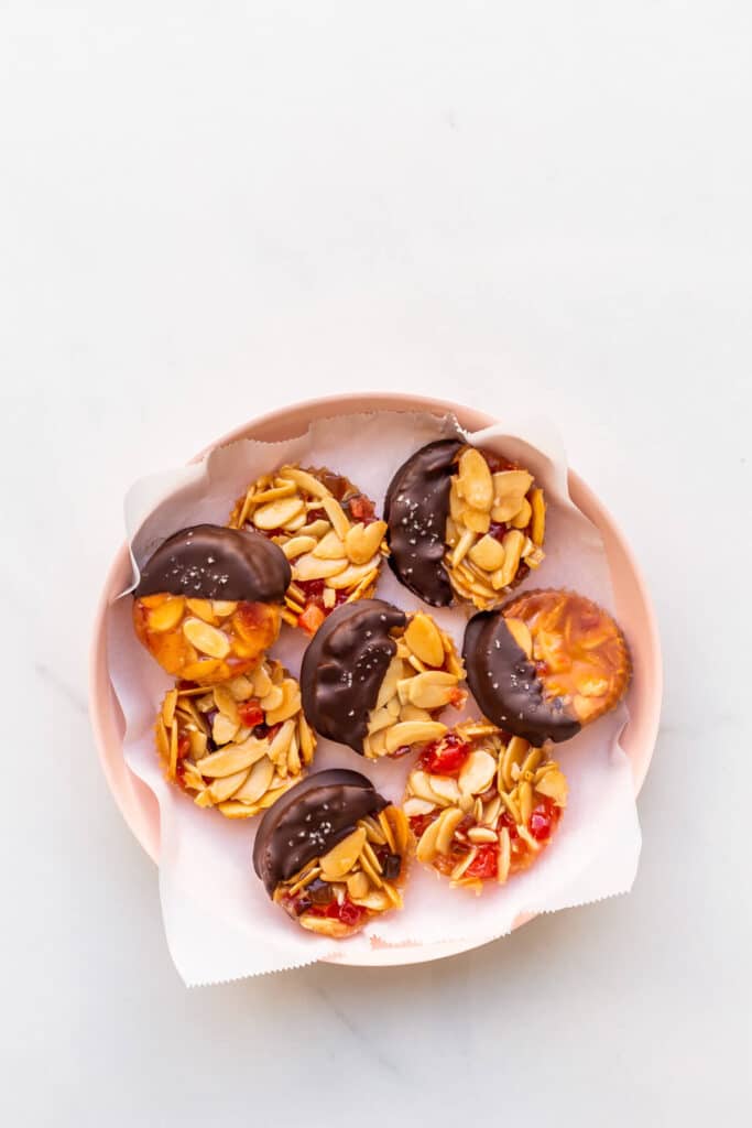 A plate of chocolate-dipped florentine cookies.