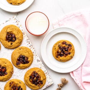 Freshly baked mincemeat cookies served with a glass of milk.