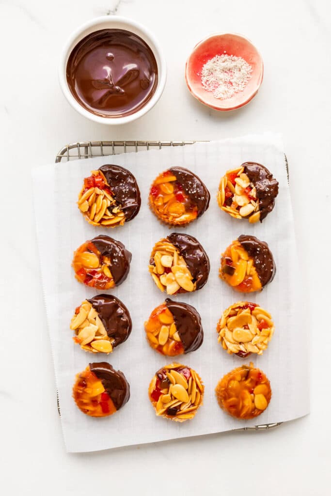 Dipping florentine cookies in melted chocolate, then sprinkling with a little salt.