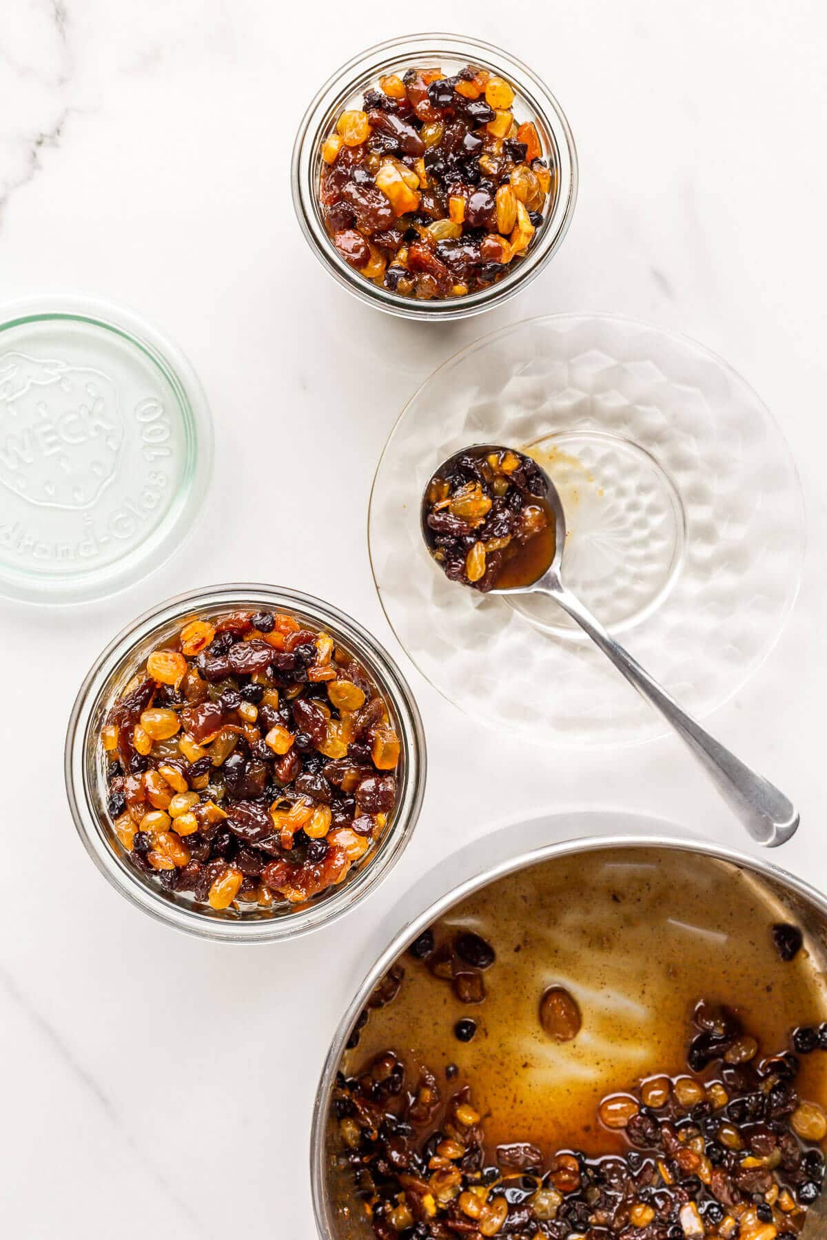 Transferring homemade mincemeat filling to jars to store for making mincemeat tarts.