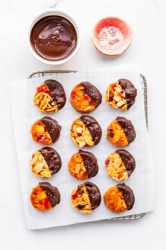 Almond florentine cookies dipped in chocolate and sprinkled with sea salt.