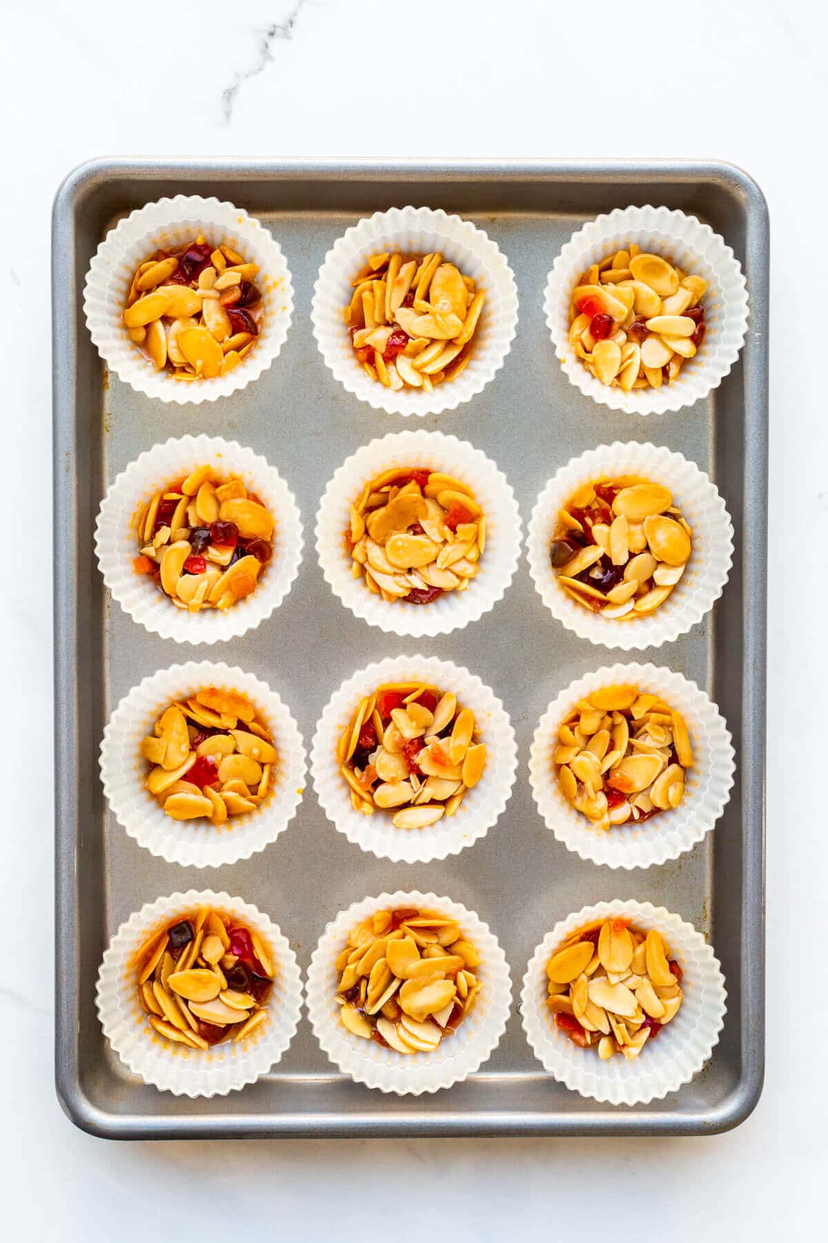 Almond florentine cookies baked in silicone muffin liners.
