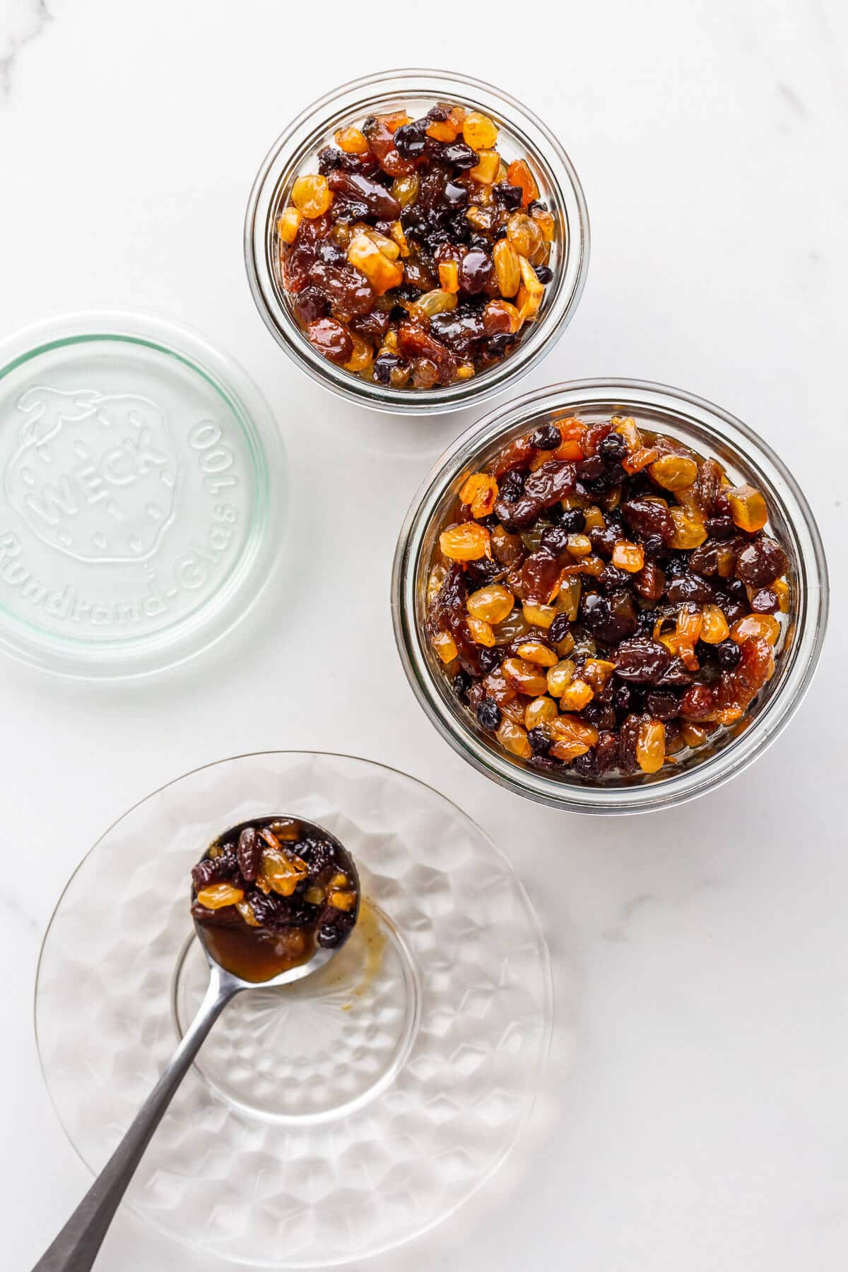 Transferring homemade mincemeat filling to jars to store for making mincemeat tarts.