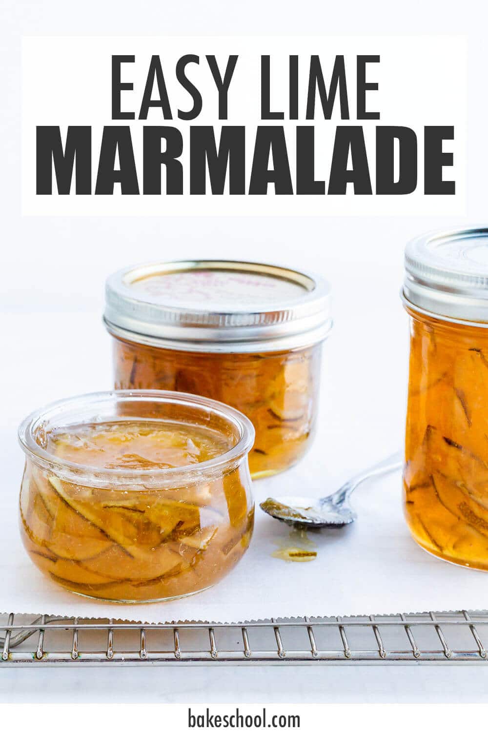 Jars of homemade lime marmalade on a cooling rack made with an easy lime marmalade recipe.
