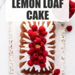 Iced lemon loaf cake on a terrazzo board.