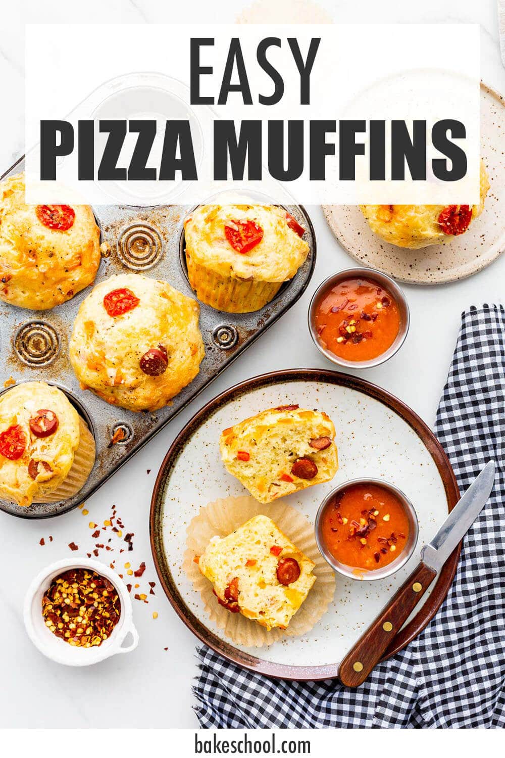 Pizza muffins served with marinara dipping sauce and hot pepper flakes.