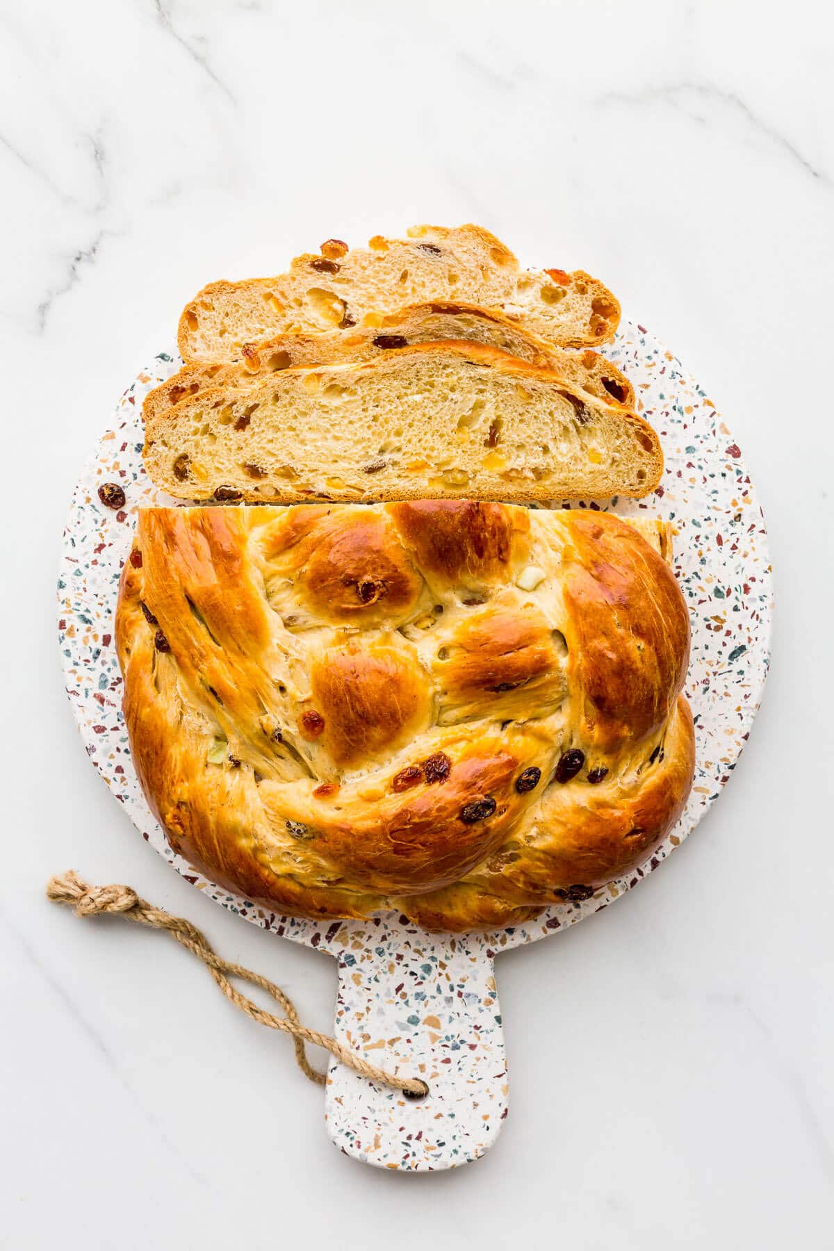 Christmas fruit bread on a board, sliced.