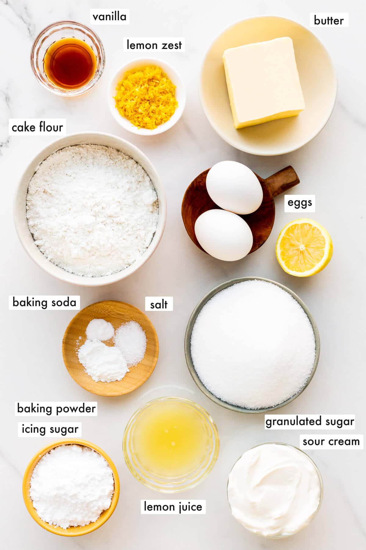 Ingredients to make lemon loaf cake from scratch measured out and ready to mix.