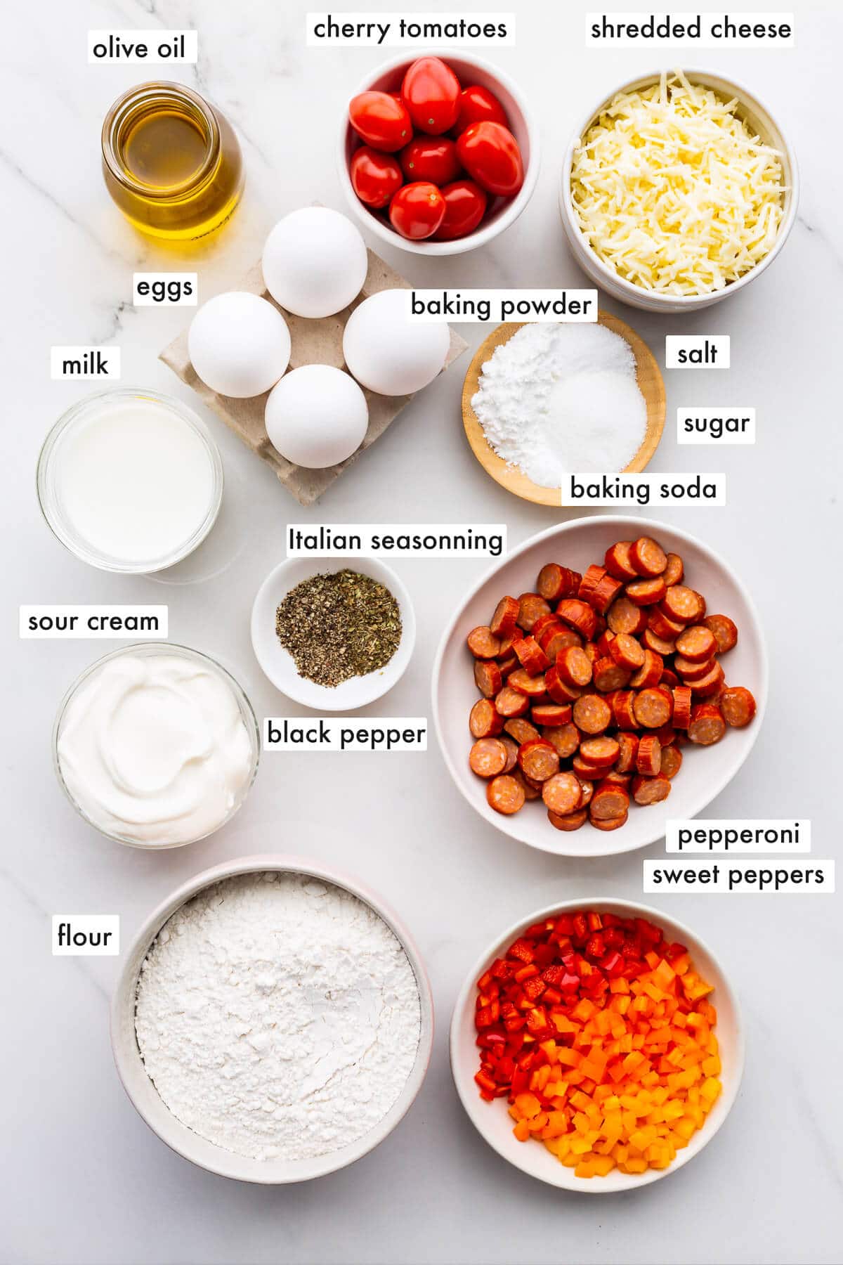 Ingredients to make pizza muffins with all the toppings.