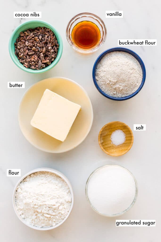 Ingredients to make shortbread cookies with cocoa nibs and buckwheat flour.