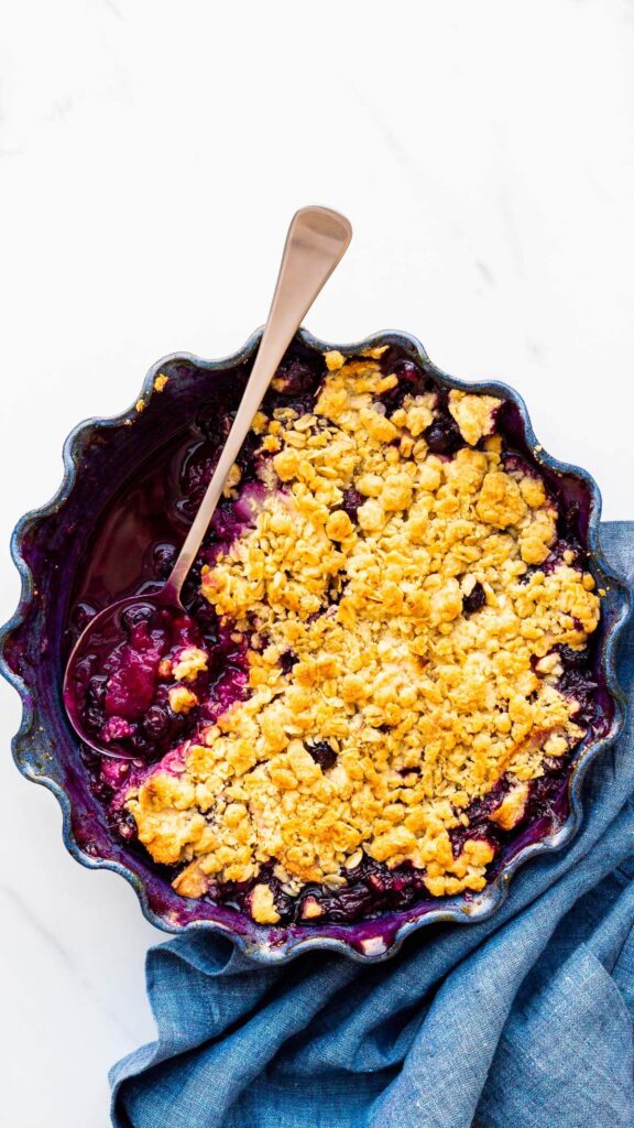 Serving apple and blueberry crumble.